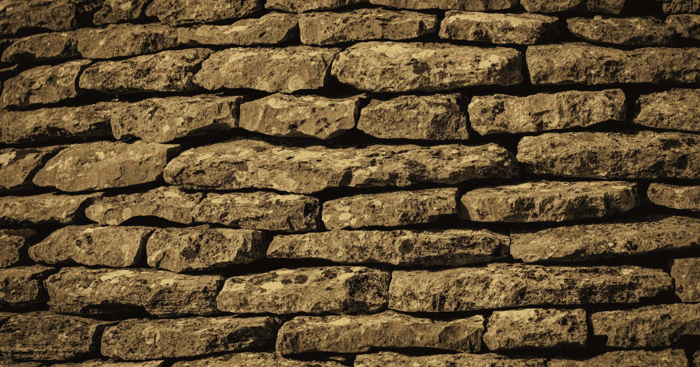 Neatly coursed stone walling built without mortar