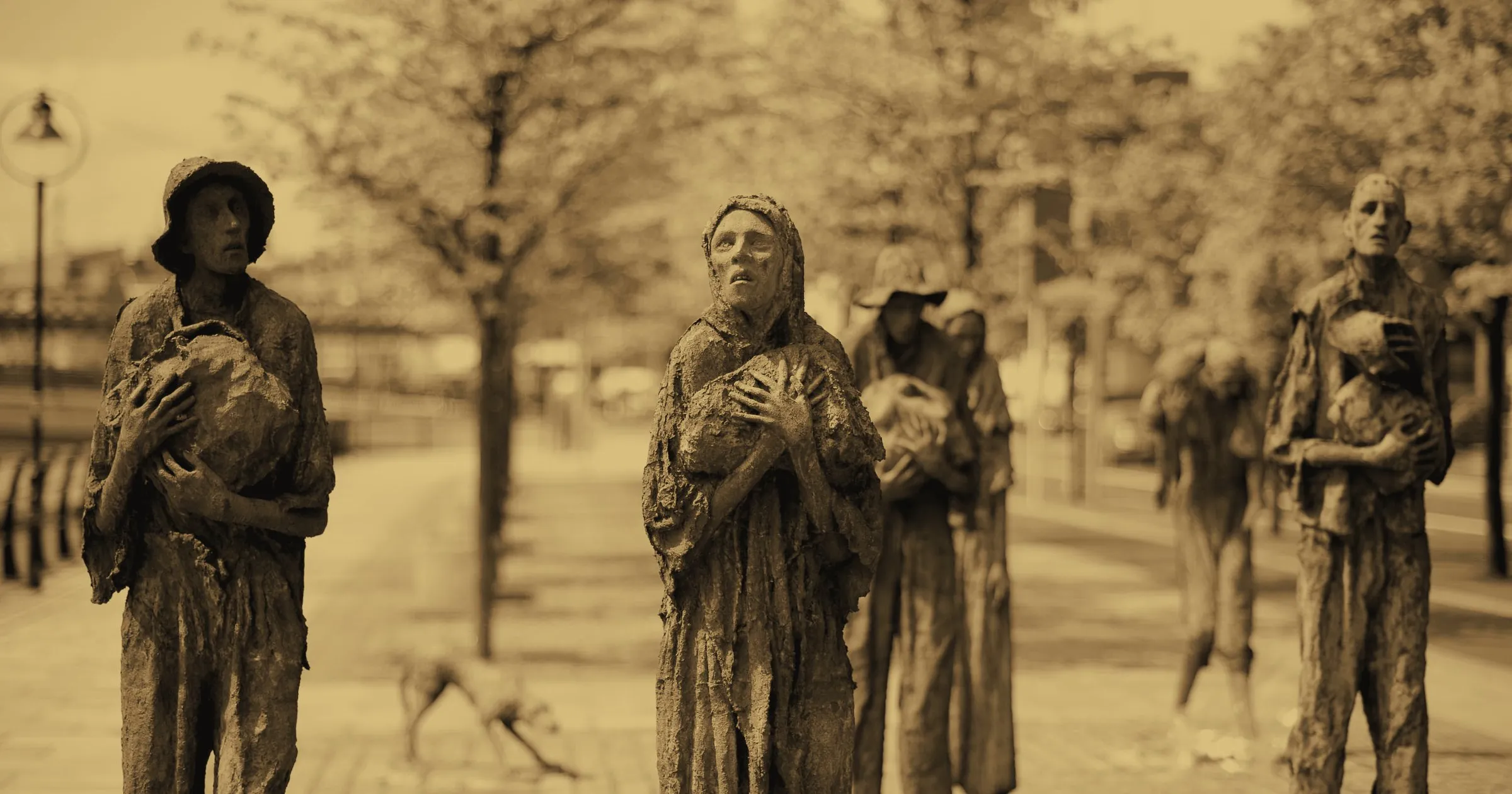 Bronze figures of the Famine Memorial on the quays in Dublin