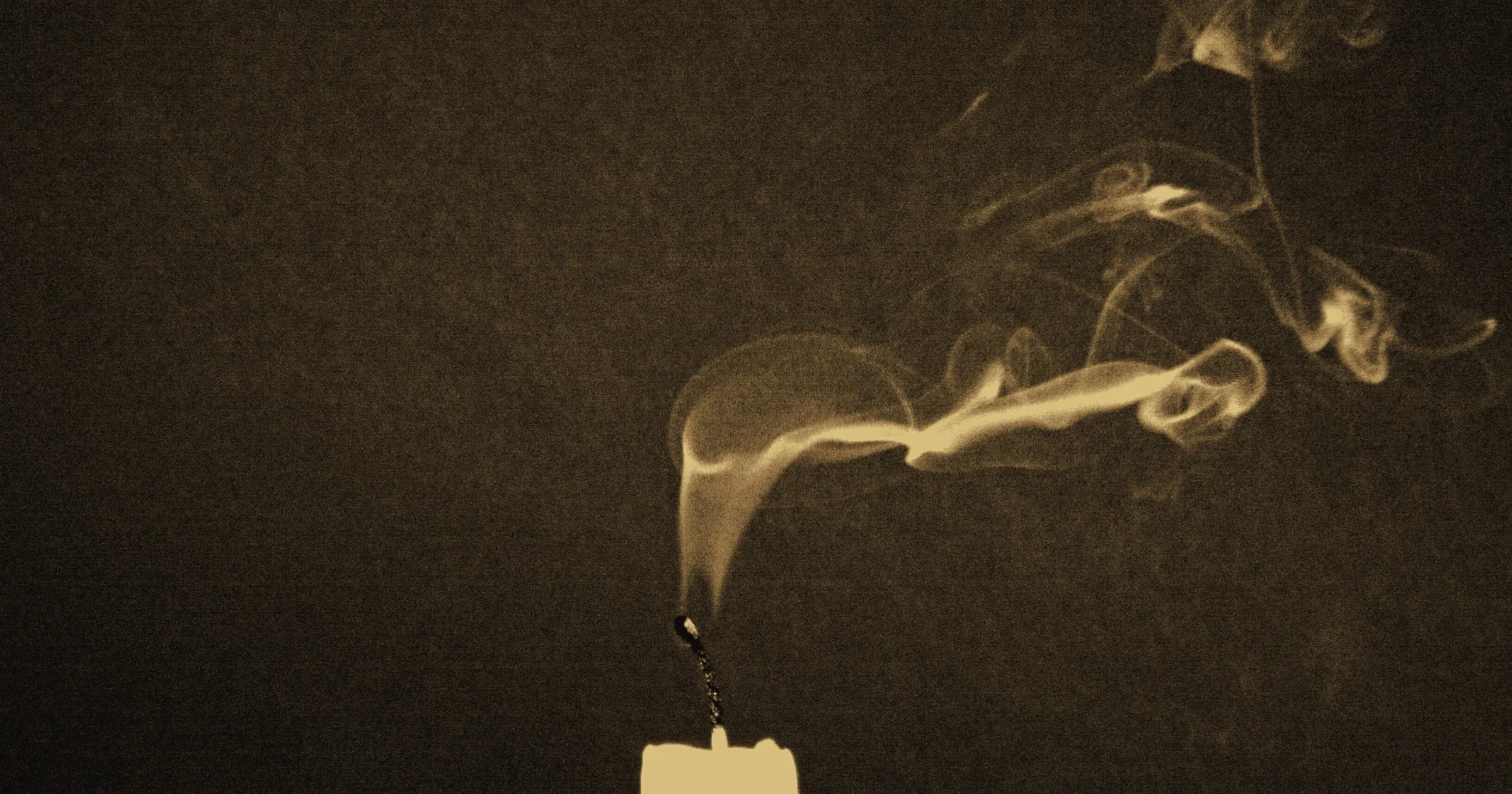 Smoke rising from a candle that has just been blown out
