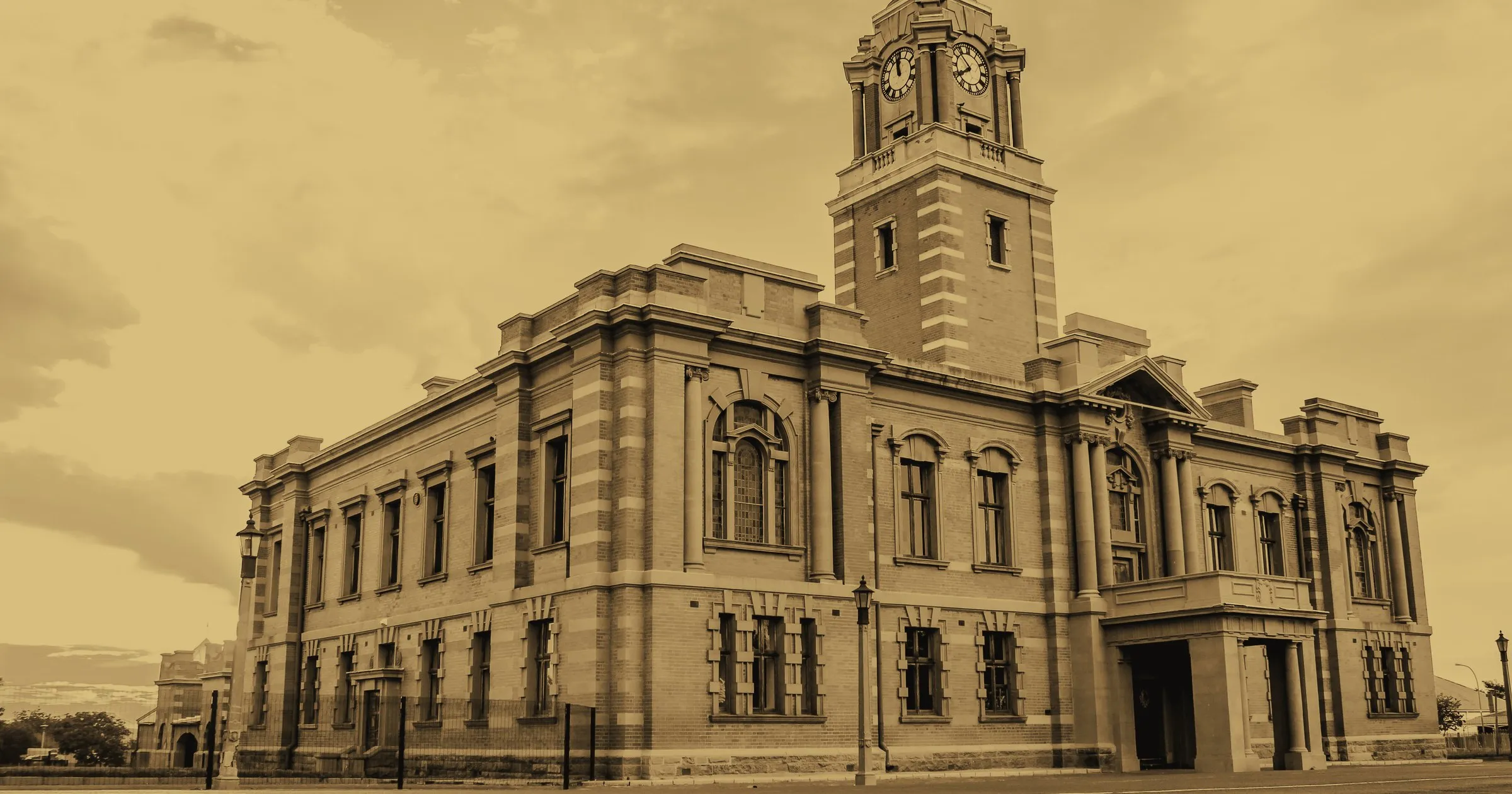 A colonial-era civic building with a clock tower