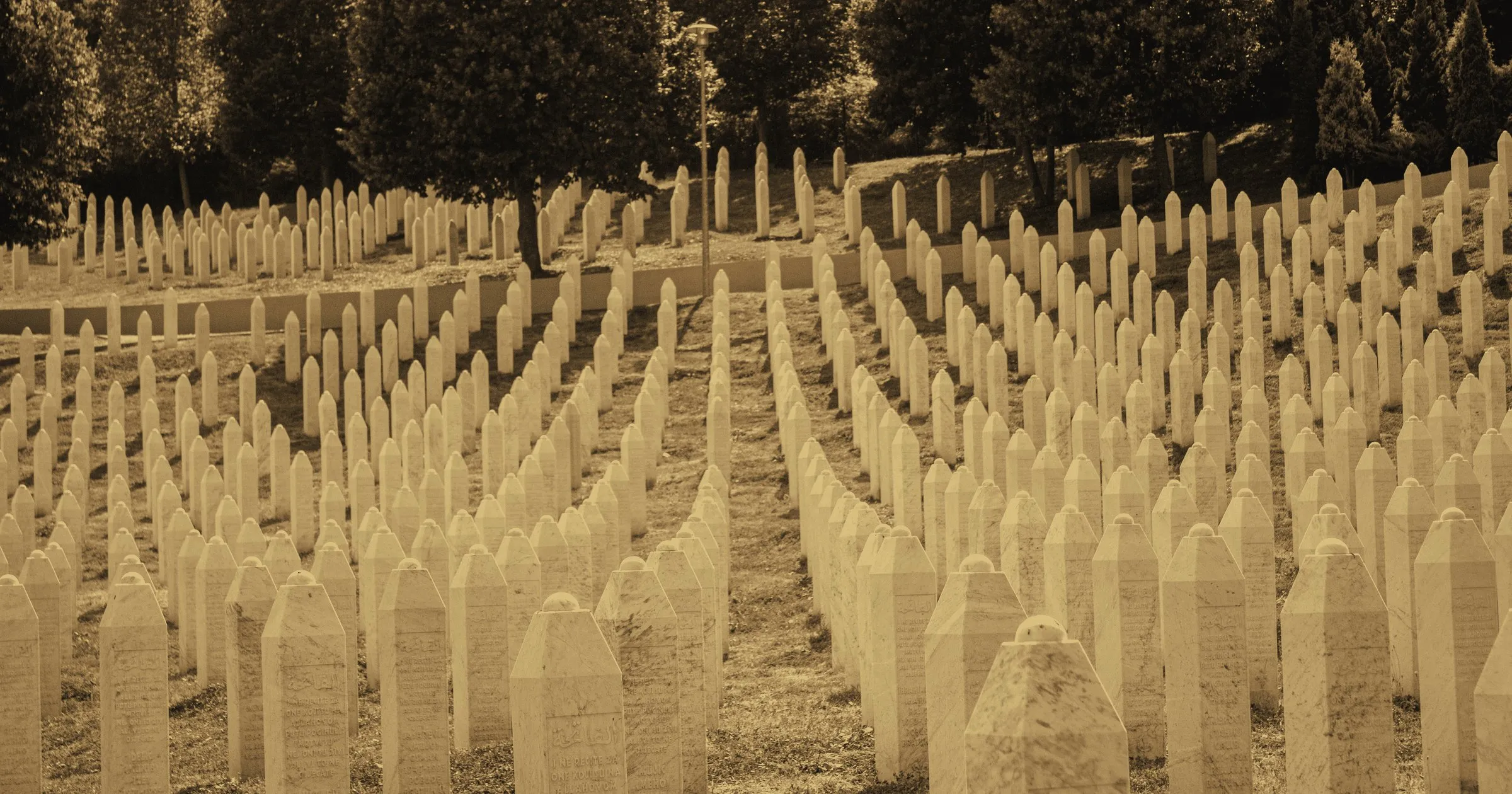 Rows of white headstones at the Srebrenica memorial in Potočari