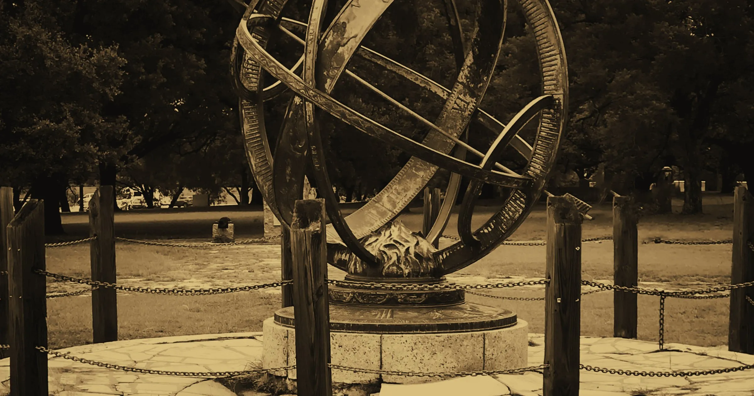 An armillary sphere, an old astronomical instrument, standing in a park